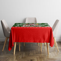 Rectangular tablecloth with red center and green tropical holiday design for dining