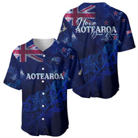 Two blue baseball jerseys with Aotearoa graphics, showing front and back designs.