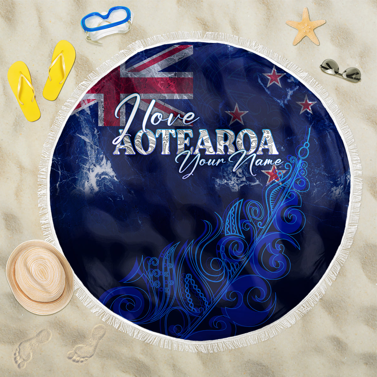 Round blue beach blanket with fringed edge, 'Love Aotearoa' text and flag design