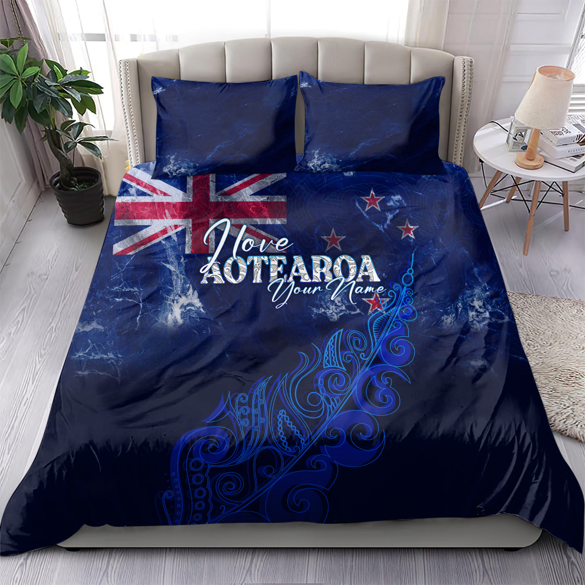 Personalised blue duvet and pillowcases with Love Aotearoa text, UK flag and fern motif