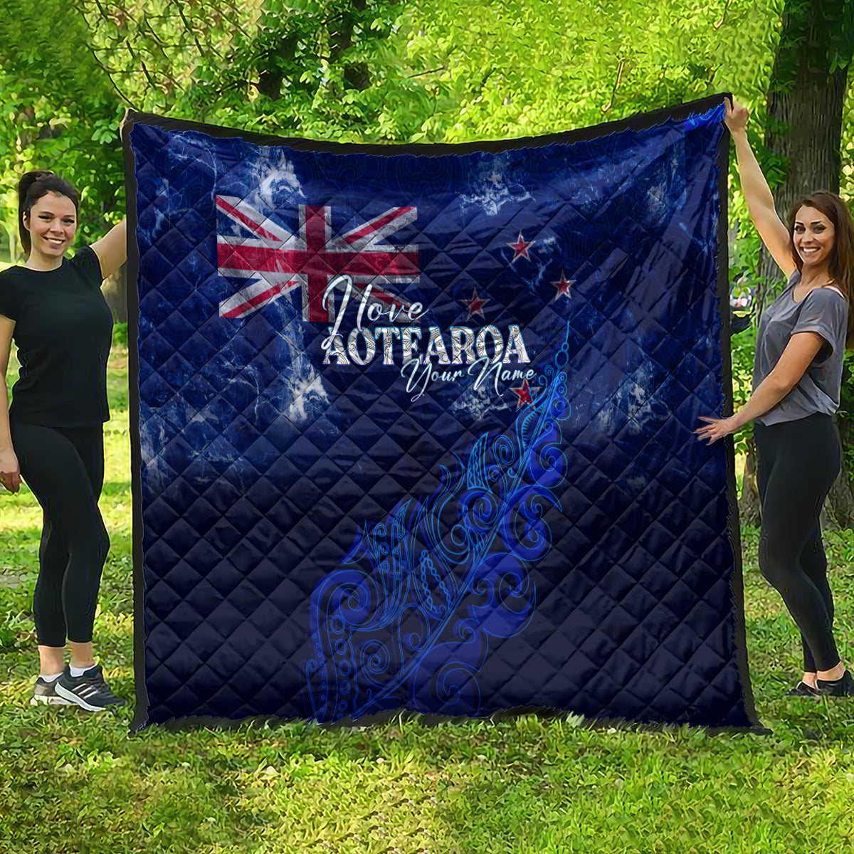 Blue quilt showing Union Jack, 'Love Aotearoa' lettering, and New Zealand map design
