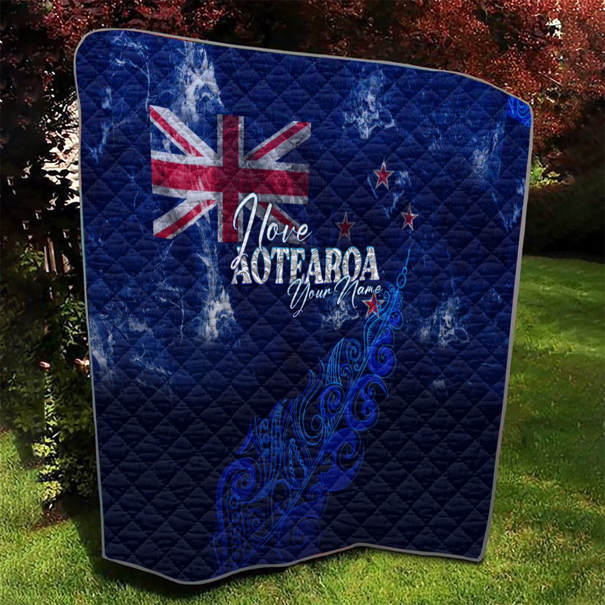 Blue quilt with Union Jack, 'Love Aotearoa' text, and swirling New Zealand map artwork
