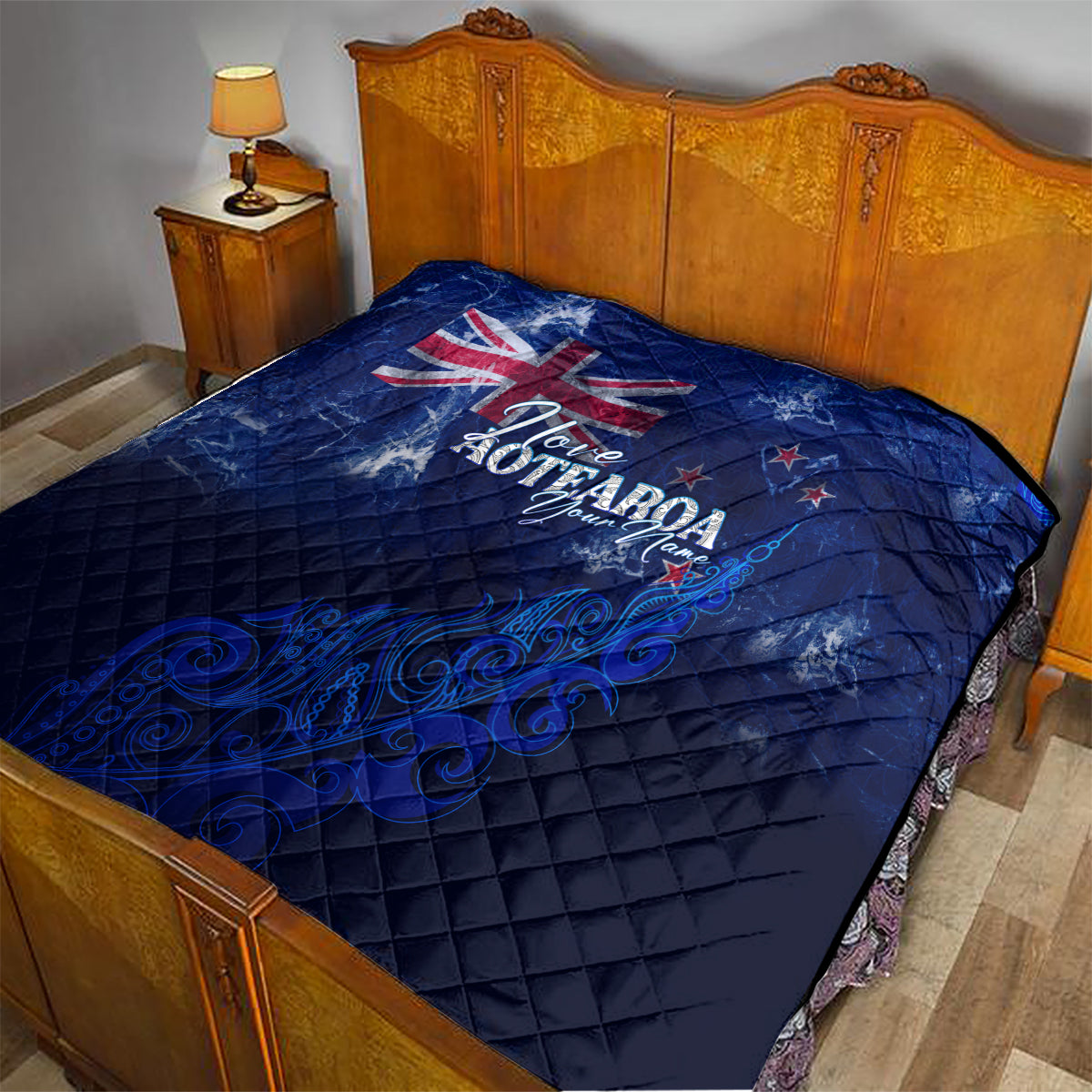 Blue quilt with Union Jack and 'Love Aotearoa' print on a diamond-quilted surface