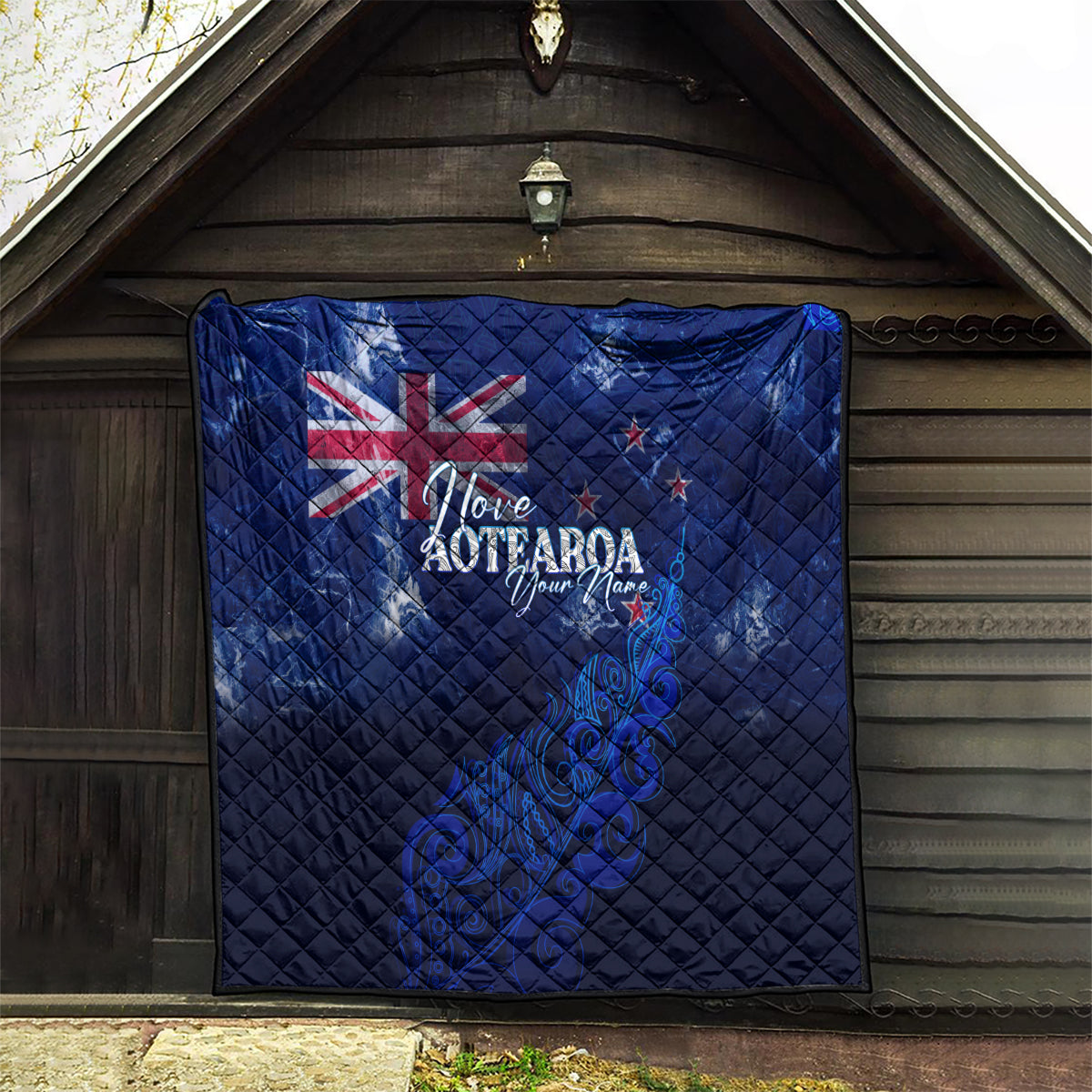 Blue quilt with Union Jack, 'Love Aotearoa' text, and New Zealand map fern artwork