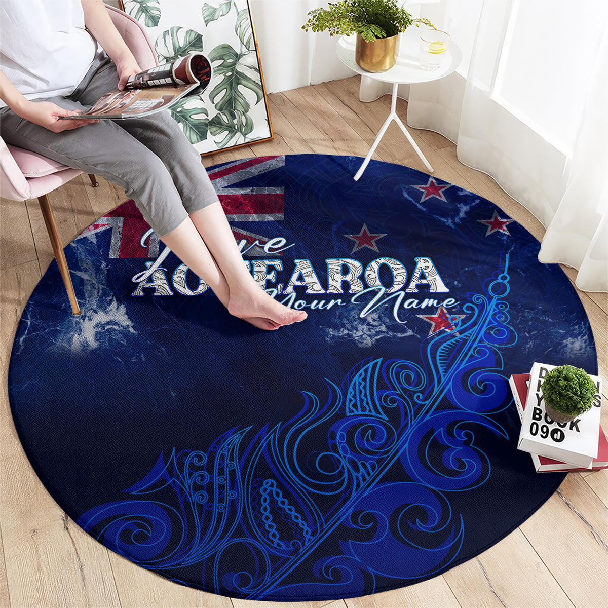 Round blue Aotearoa rug with “I love AOTEAROA” lettering and decorative fern scrolls