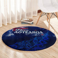 Round blue Aotearoa rug with “I love AOTEAROA” message and decorative fern patterns