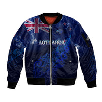 Blue zip-up bomber jacket with Aotearoa map, silver fern, Union Jack sleeve design