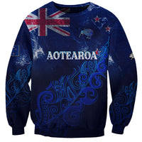 Unisex blue sweatshirt with AOTEAROA lettering and New Zealand map graphic