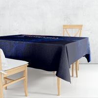Blue tablecloth draped over rectangular table with Aotearoa map motif