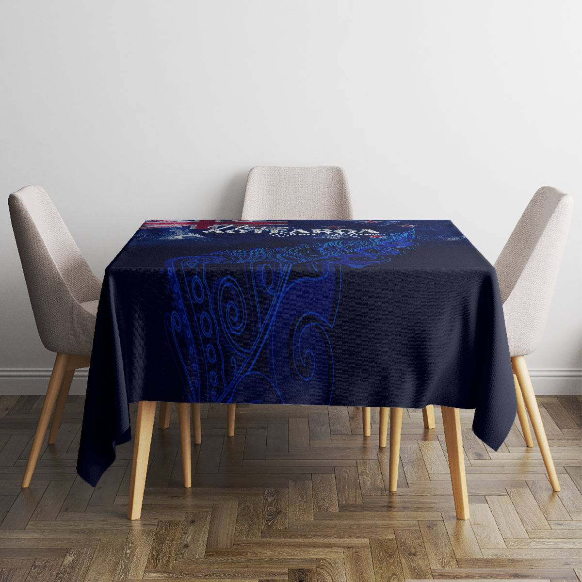 Blue New Zealand tablecloth on square table with “Love Aotearoa” and fern
