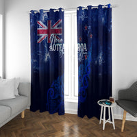 Blue pair of hanging New Zealand curtains with silver fern and map graphic