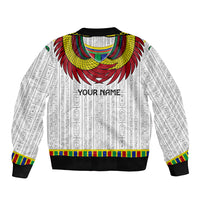 White unisex bomber jacket with Egyptian pattern, large Horus wings, and 'YOUR NAME' text