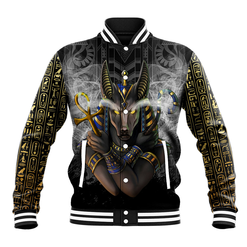 Unisex black baseball jacket with Anubis Egyptian graphic and gold hieroglyph sleeves