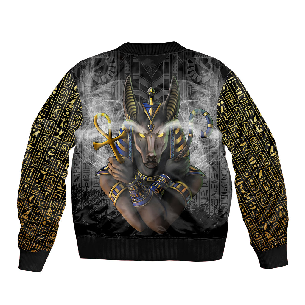Unisex bomber jacket black with Egyptian-style Anubis back graphic and gold hieroglyph sleeves