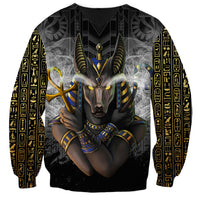Black crewneck sweatshirt with Egyptian Anubis portrait graphic across front and sleeves