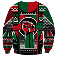 Crew-neck unisex sweatshirt with graphic fist emblem and vibrant geometric patchwork