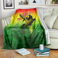 Bob Marley graphic blanket with red-yellow-green gradient and guitar portrait