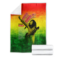 Bob Marley graphic blanket folded, red-yellow-green gradient with guitar portrait