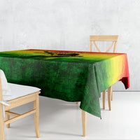 Rectangular tablecloth draped over table, green yellow red gradient print