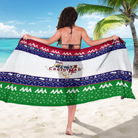 Christmas sarong back view, white fabric with navy trim and green bottom band.