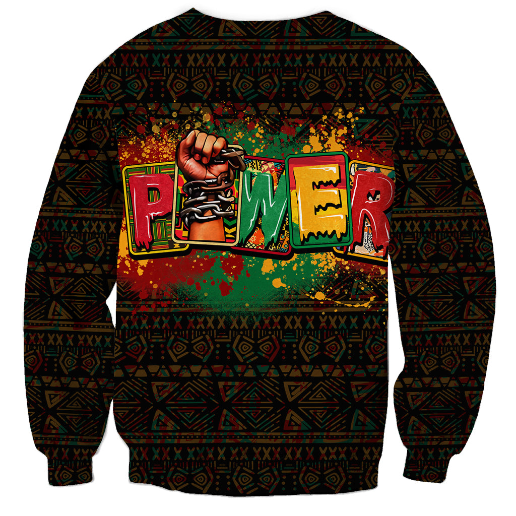 Black crewneck sweatshirt with large central African text/hand graphic and patterned sleeves