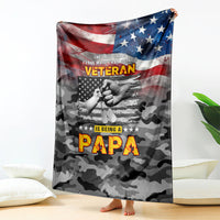 American flag and veteran slogan camo blanket draped over surface, dark gray with red blue