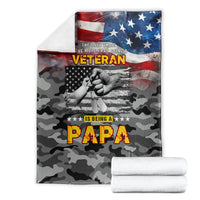 Folded veteran camo blanket with American flag, 'Papa' graphic, dark gray/black