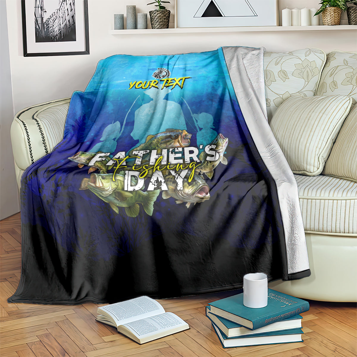 Blue and black bass fishing blanket draped over sofa with fish graphic and 'FATHER'S'