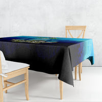 Blue and black fishing tablecloth draped over rectangular table