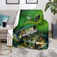 Green bass fishing Father's Day blanket on gray chair, fisherman silhouette and bass artwork