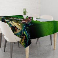 Green bass fishing tablecloth with colorful fish print over a dining table