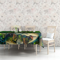 Green bass fishing tablecloth with large fish artwork and decorative leaf accents