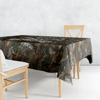 Camouflage woodland tablecloth draped over a dining table with corner drop