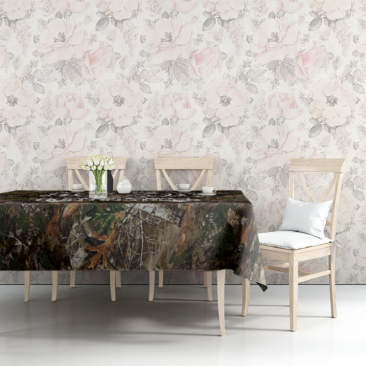 Camouflage woodland tablecloth on a dining table with white chairs and decor