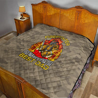 Grey firefighter quilt on bed with flame-emblem graphic and “Makes the Best Dad”