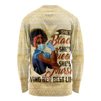 Beige long sleeve shirt with geometric pattern and nurse graphic centered on back