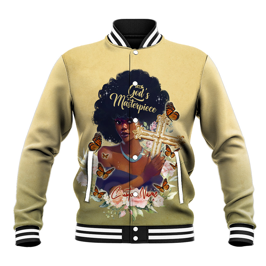 Beige baseball jacket with ribbed striped collar, cuffs, and front graphic 'God's Masterpiece'