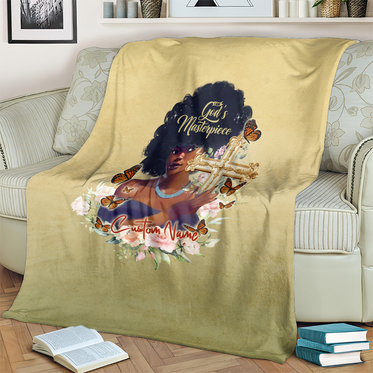 Beige personalized blanket draped on couch showing African woman portrait with cross and flowers