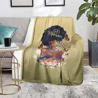Beige personalized throw blanket on floor featuring African woman portrait graphic