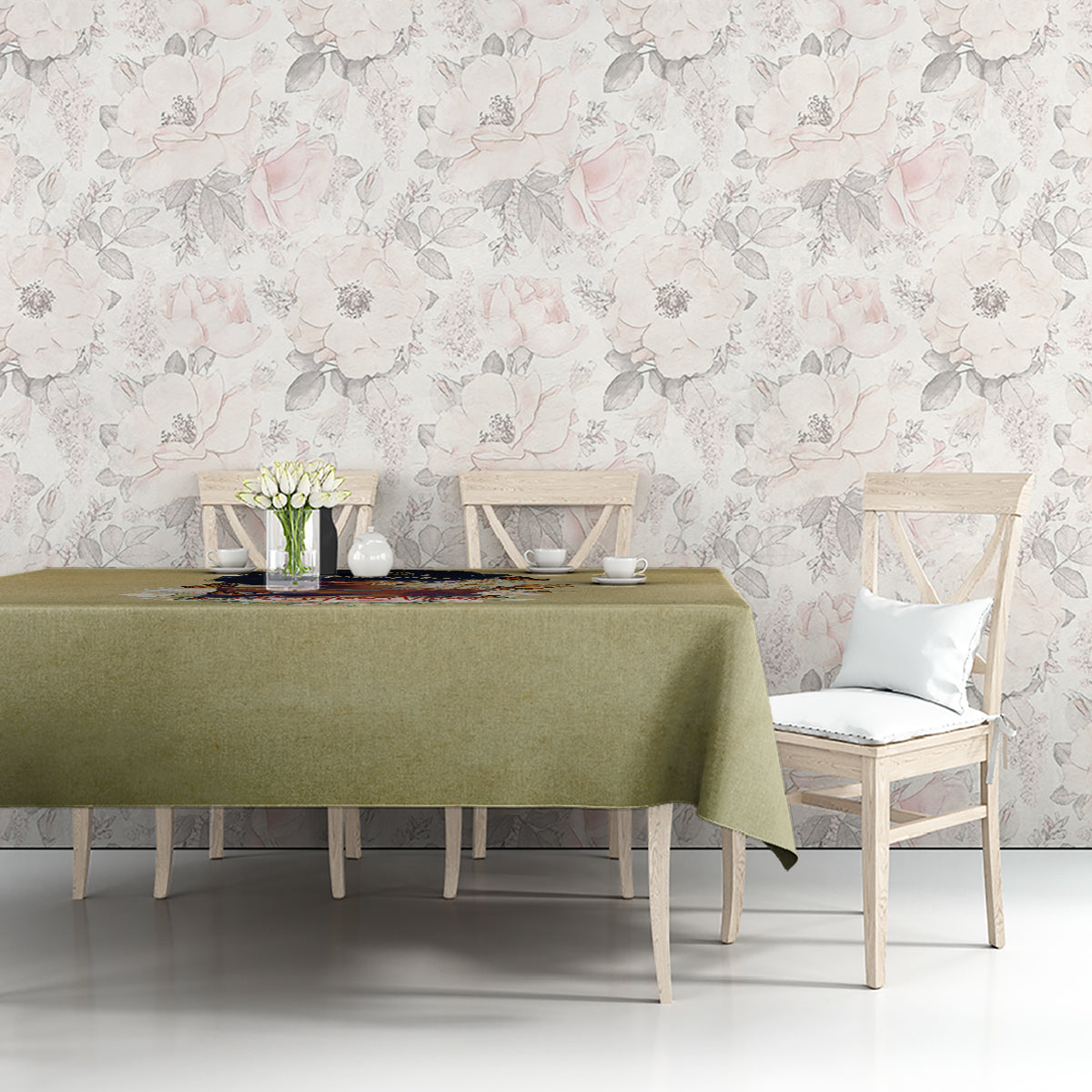 Beige tablecloth over dining table with centered floral religious text print