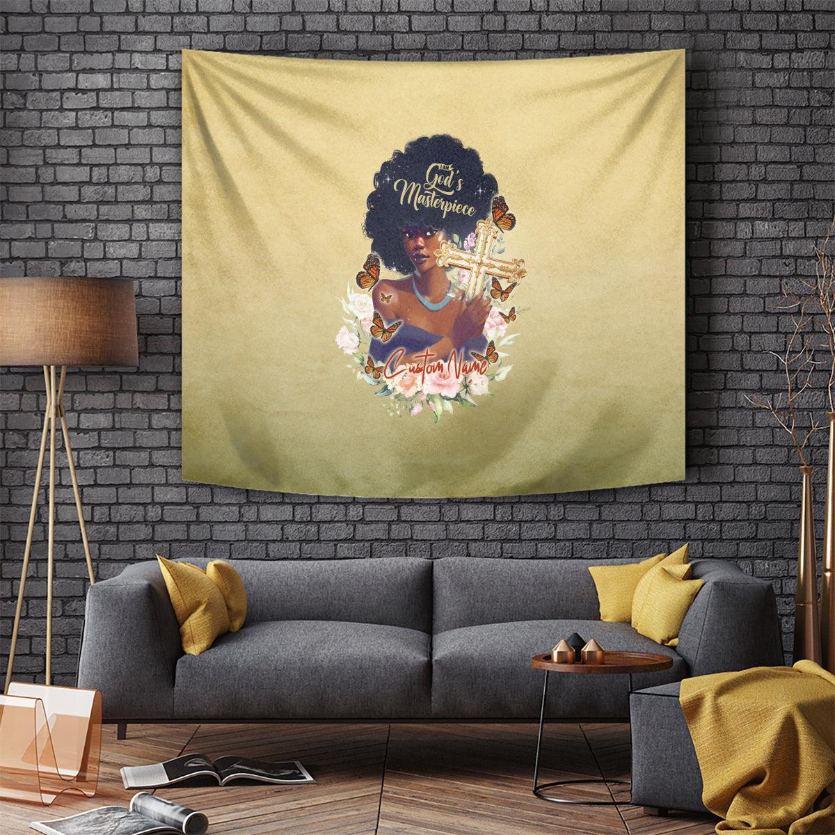 Beige tapestry hanging on a brick wall with African woman holding a gold cross design