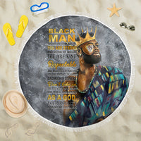 Round black beach blanket with printed face and crown, gold text, white fringe edge