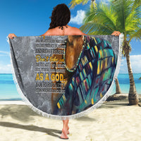 Round black beach blanket with printed face and gold crown text, fringed border, held up