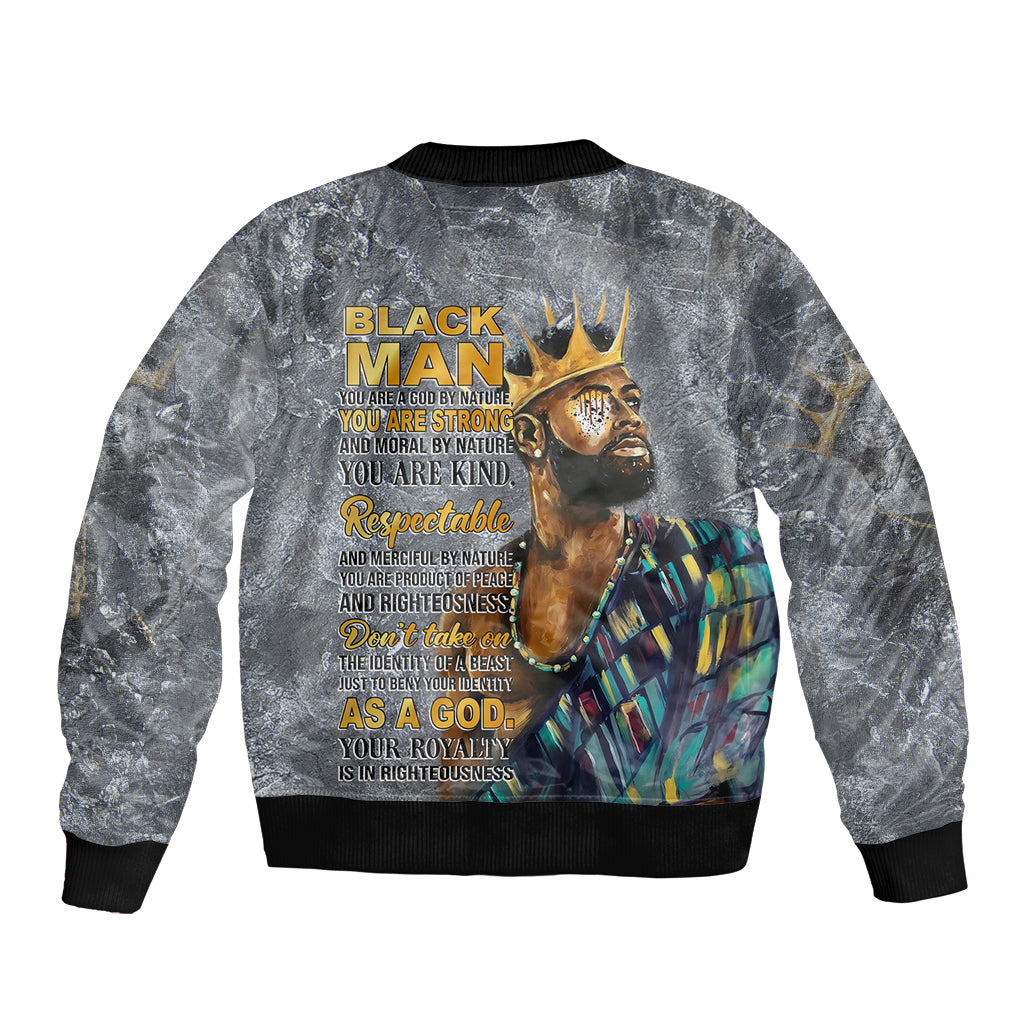 Black bomber jacket with ribbed hem and back graphic featuring face and crown artwork