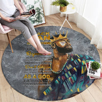 Round dark gray rug featuring a lion portrait and multicolor plaid-style background
