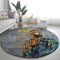 Round dark gray living room rug with lion face artwork and gold quote text