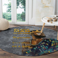 Round dark gray carpet with lion head illustration and stacked gold lettering