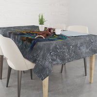 Dark blue-gray printed tablecloth covering dining table, corners draped to the floor