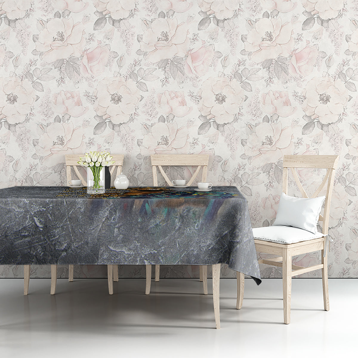 Dark blue-gray printed tablecloth on dining table with portrait graphic and blue accents