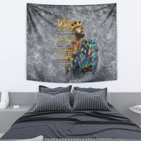 Gray tapestry wall hanging with crowned portrait, multicolor clothing, and vertical yellow text